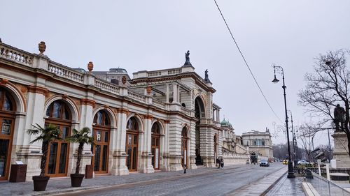 Street amidst buildings against sky in city