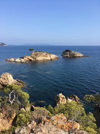 Scenic view of sea against clear blue sky