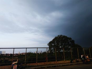 Group of people on road against sky