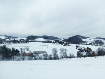 Scenic view of snowcapped mountains against sky during winter