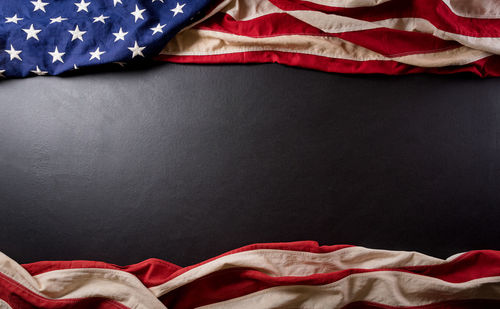 Low angle view of flags over black background