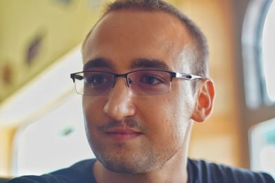 Close-up of young man wearing eyeglasses