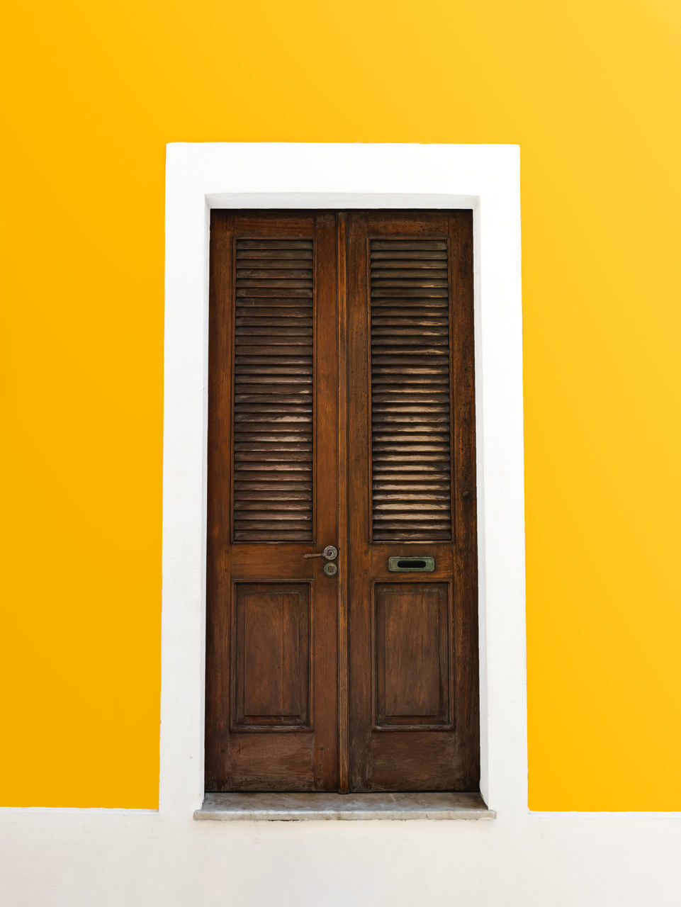 architecture, door, entrance, closed, building exterior, yellow, built structure, building, house, wood, no people, protection, security, residential district, wall - building feature, window, copy space, front door, outdoors, day, facade