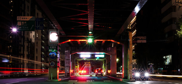 Illuminated city street at night