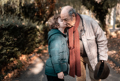 Rear view of couple standing outdoors