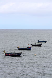 Boats sailing in sea
