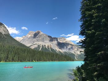 Scenic view of mountains against blue sky