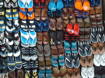 Full frame shot of colorful sandals for sale at market