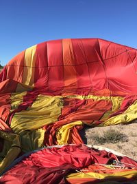 Low angle view of hot air balloon against blue sky