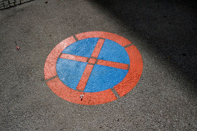 High angle view of road sign on street