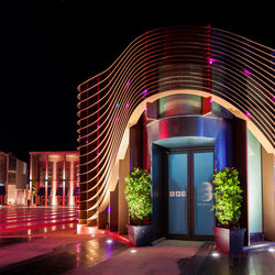 View of illuminated building against sky at night