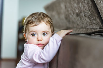 Portrait of cute baby girl at home