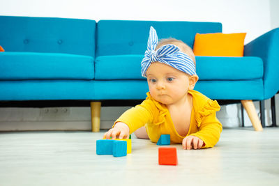 Portrait of cute boy playing with toy blocks
