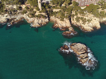 High angle view of rock formation in sea