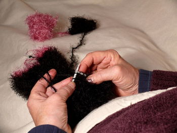 Close-up of woman hand with needles