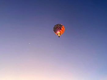 Low angle view of hot air balloon flying in sky