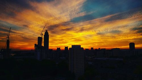 Silhouette of city at sunset