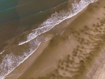 Close-up of waves rushing towards shore