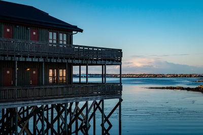 Pier over sea against clear sky