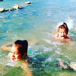 Portrait of happy girl in water