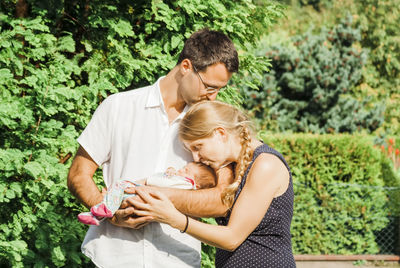 Happy family standing at park