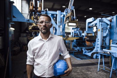 Portrait of man working in factory