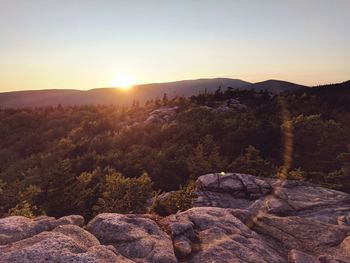 Scenic view of landscape against sky during sunset