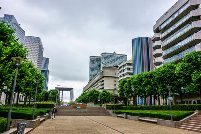 Buildings in city against sky