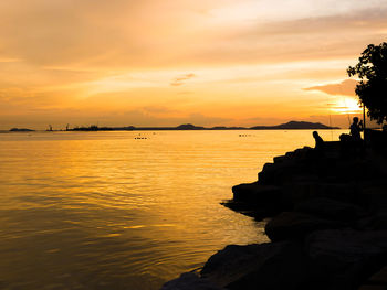 Scenic view of sea against sky during sunset