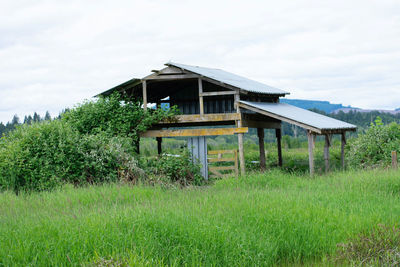 House on field against sky