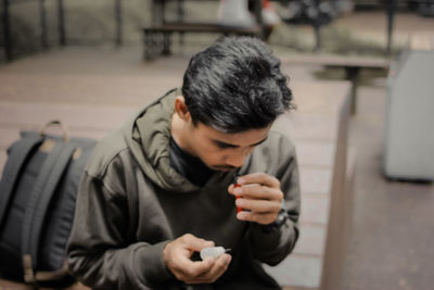 Young man using mobile phone