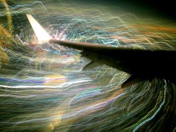 Aerial view of illuminated light trails at night