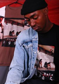 Portrait of young man sitting at home