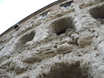 Low angle view of stone wall