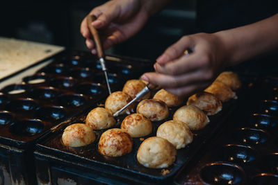 Midsection of person preparing food