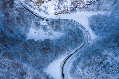 High angle view of road on snow covered landscape