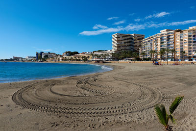 View of beach with city in background