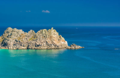 Scenic view of sea against blue sky