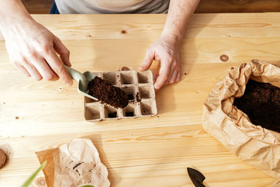 Midsection of man preparing food on table