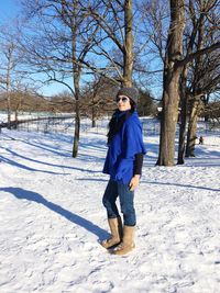 Full length portrait of man standing in snow