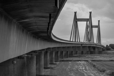 View of bridge against cloudy sky