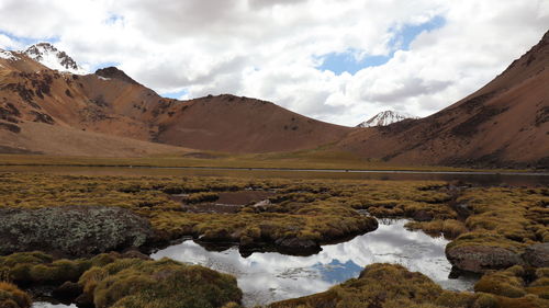 Atmospheric shot of high altitude lake surrounded by volcanic landscape