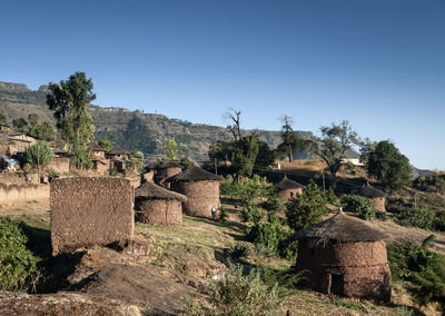 Built structure on landscape against clear sky