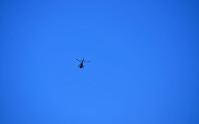 Low angle view of airplane flying in sky