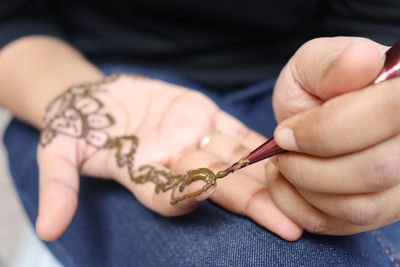 Close-up of woman holding hands