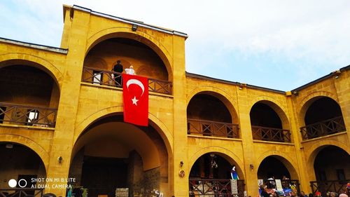 People in front of historical building