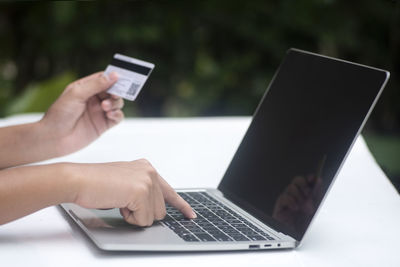 Close-up of hand holding mobile phone