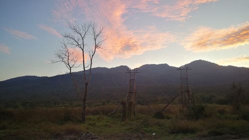 Scenic view of field against sky during sunset