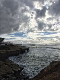 Scenic view of sea against cloudy sky