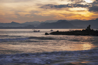 Scenic view of sea against sky during sunset